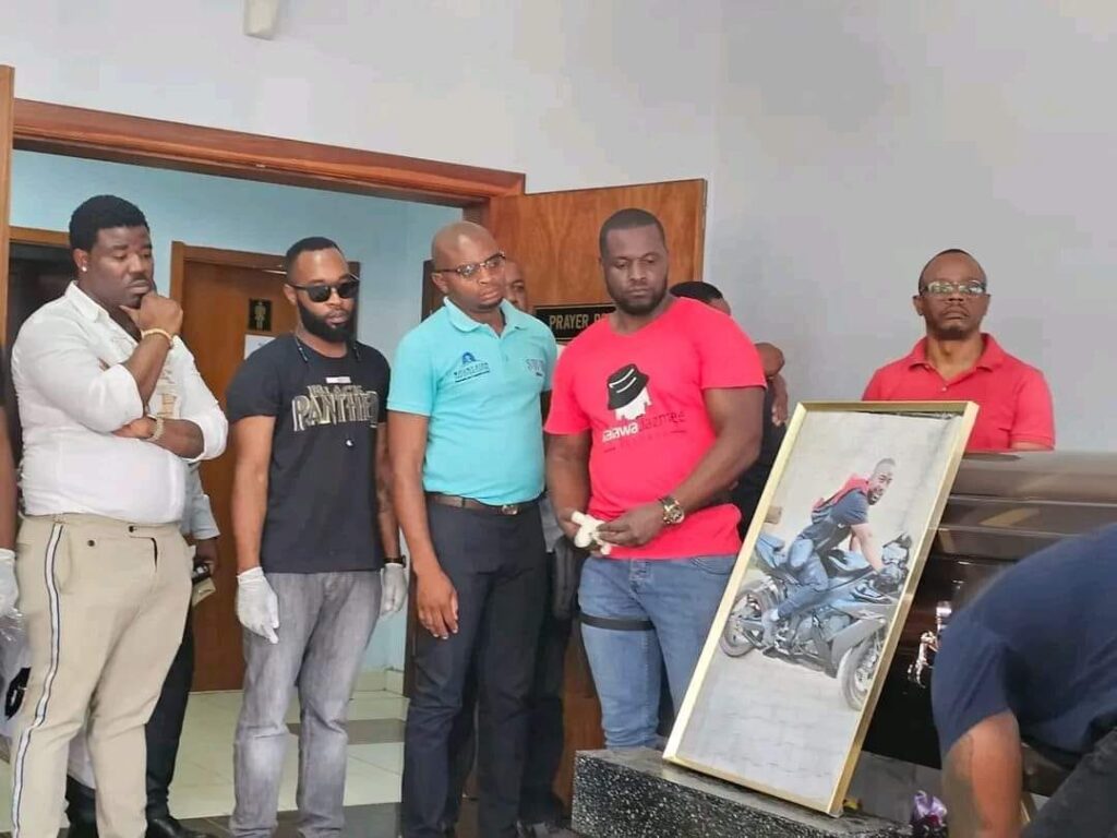 SAD FACES: Grief-stricken friends of Kash Money who died in a motorbike